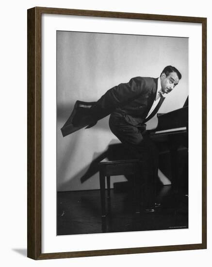 Comedian Pianist Victor Borge, in White Tie and Tails, Standing at Piano and Making Funny Faces-Peter Stackpole-Framed Premium Photographic Print