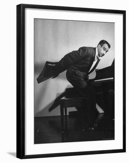 Comedian Pianist Victor Borge, in White Tie and Tails, Standing at Piano and Making Funny Faces-Peter Stackpole-Framed Premium Photographic Print