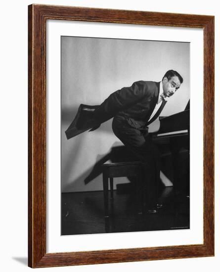 Comedian Pianist Victor Borge, in White Tie and Tails, Standing at Piano and Making Funny Faces-Peter Stackpole-Framed Premium Photographic Print