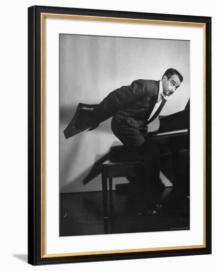 Comedian Pianist Victor Borge, in White Tie and Tails, Standing at Piano and Making Funny Faces-Peter Stackpole-Framed Premium Photographic Print