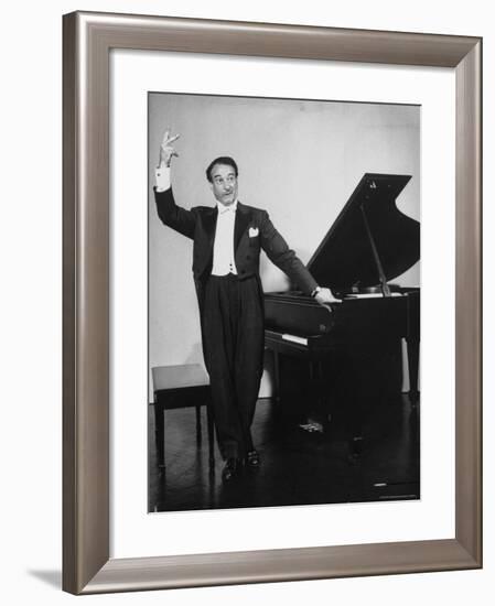 Comedian Pianist Victor Borge, in White Tie and Tails, Standing at Piano and Making Funny Faces-Peter Stackpole-Framed Premium Photographic Print