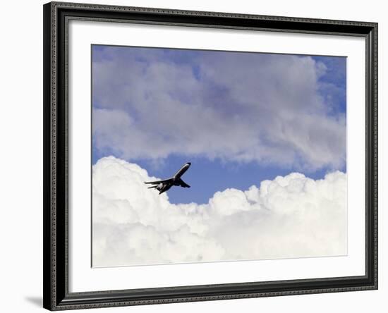 Commercial Airplane Soaring Above the Clouds-Mitch Diamond-Framed Photographic Print