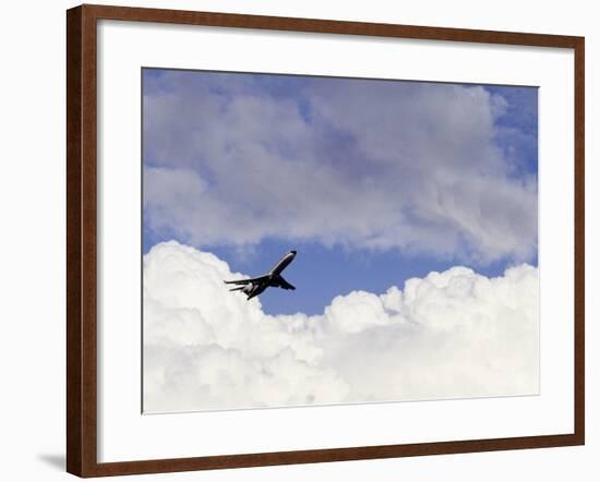 Commercial Airplane Soaring Above the Clouds-Mitch Diamond-Framed Photographic Print