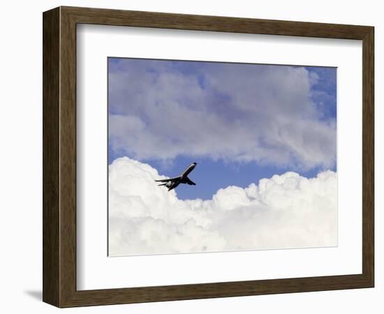 Commercial Airplane Soaring Above the Clouds-Mitch Diamond-Framed Photographic Print