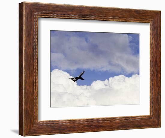 Commercial Airplane Soaring Above the Clouds-Mitch Diamond-Framed Photographic Print