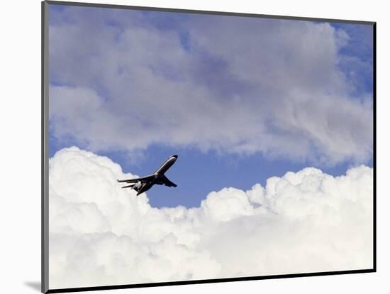 Commercial Airplane Soaring Above the Clouds-Mitch Diamond-Mounted Photographic Print