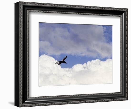 Commercial Airplane Soaring Above the Clouds-Mitch Diamond-Framed Photographic Print