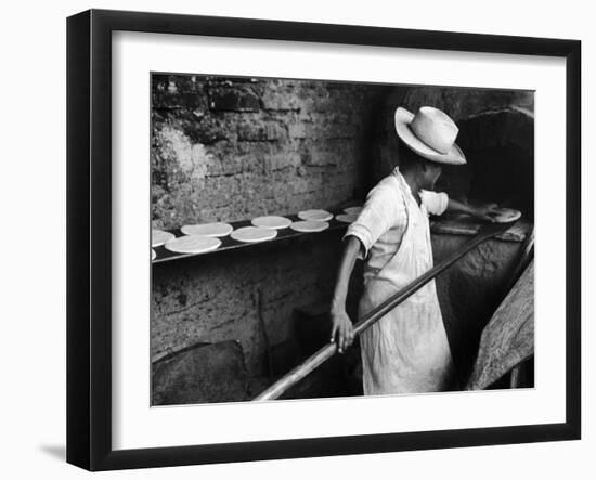 Communal Bakery in Primitive Mexican Village, Loaves of Bread Being Shoved into Adobe Oven-null-Framed Photographic Print