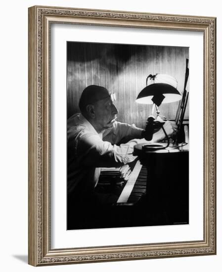 Composer Igor Stravinsky Working at a Piano in an Empty Dance Hall in Venice-Gjon Mili-Framed Premium Photographic Print