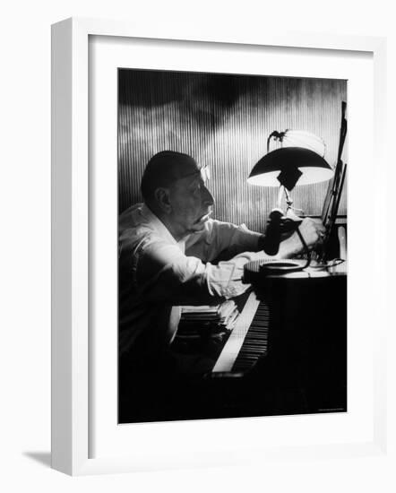 Composer Igor Stravinsky Working at a Piano in an Empty Dance Hall in Venice-Gjon Mili-Framed Premium Photographic Print