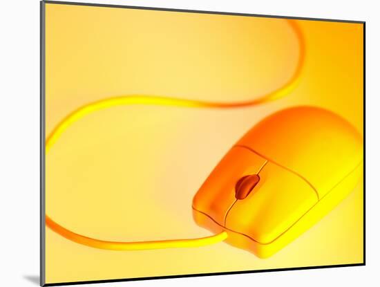Computer Mouse in Yellow Light-null-Mounted Photographic Print