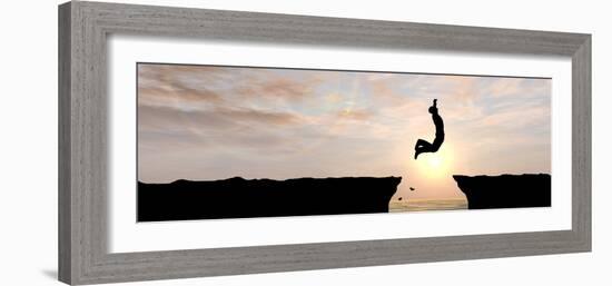 Concept or Conceptual Young Man, Businessman Silhouette Jump Happy from Cliff over Water Gap Sunset-bestdesign36-Framed Photographic Print