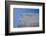 Concrete grey wall with structure and inclusions as a background in front of sky blue cloudless-Axel Killian-Framed Photographic Print