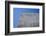 Concrete grey wall with structure and inclusions as a background in front of sky blue cloudless-Axel Killian-Framed Photographic Print