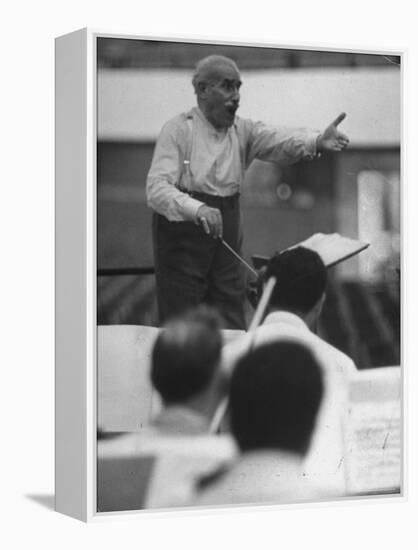 Conductor Arturo Toscanini, Singing and Shouting Instructions While Rehearsing His Men in a Gym-Joe Scherschel-Framed Premier Image Canvas