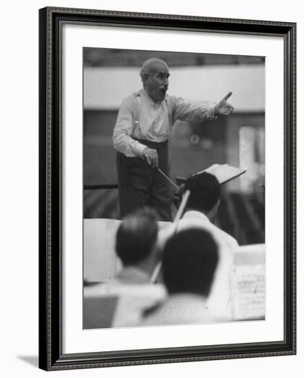 Conductor Arturo Toscanini, Singing and Shouting Instructions While Rehearsing His Men in a Gym-Joe Scherschel-Framed Premium Photographic Print