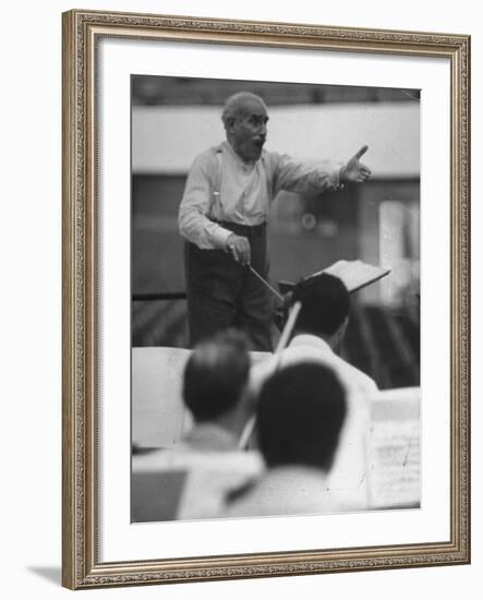 Conductor Arturo Toscanini, Singing and Shouting Instructions While Rehearsing His Men in a Gym-Joe Scherschel-Framed Premium Photographic Print
