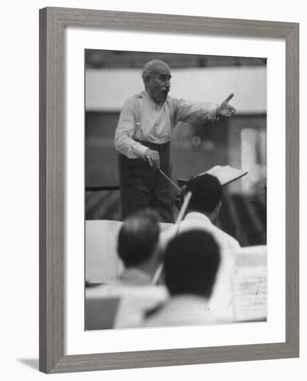 Conductor Arturo Toscanini, Singing and Shouting Instructions While Rehearsing His Men in a Gym-Joe Scherschel-Framed Premium Photographic Print