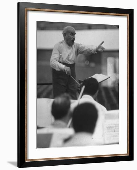 Conductor Arturo Toscanini, Singing and Shouting Instructions While Rehearsing His Men in a Gym-Joe Scherschel-Framed Premium Photographic Print