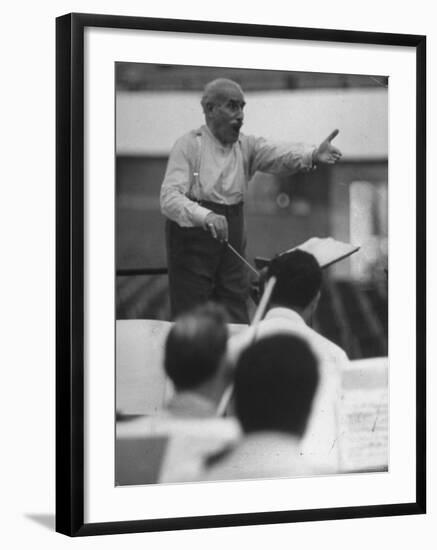 Conductor Arturo Toscanini, Singing and Shouting Instructions While Rehearsing His Men in a Gym-Joe Scherschel-Framed Premium Photographic Print