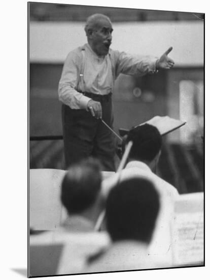 Conductor Arturo Toscanini, Singing and Shouting Instructions While Rehearsing His Men in a Gym-Joe Scherschel-Mounted Premium Photographic Print
