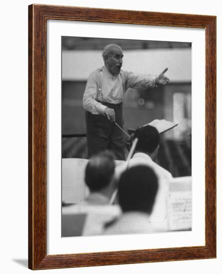 Conductor Arturo Toscanini, Singing and Shouting Instructions While Rehearsing His Men in a Gym-Joe Scherschel-Framed Premium Photographic Print