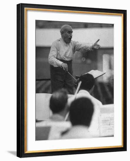 Conductor Arturo Toscanini, Singing and Shouting Instructions While Rehearsing His Men in a Gym-Joe Scherschel-Framed Premium Photographic Print