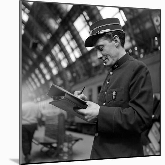 Conductor on the Orient Express Train Making Notes on a Piece of Paper, June 1950-Jack Birns-Mounted Photographic Print
