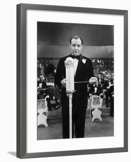 Conductor Standing in Front of His Orchestra with a Baton-null-Framed Photo