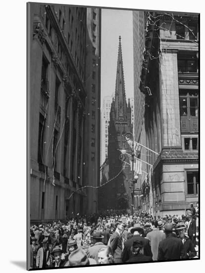 Confetti and Streamers Fly Down from Office Buildings, People Celebrating End of the War in Europe-Andreas Feininger-Mounted Photographic Print