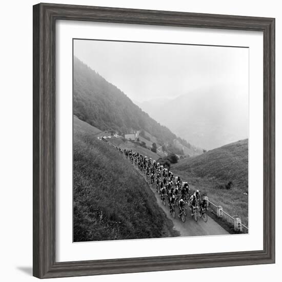 Contestants in the Grueling Tour De France are Seen on Their Way to the Mente Pass--Framed Photographic Print