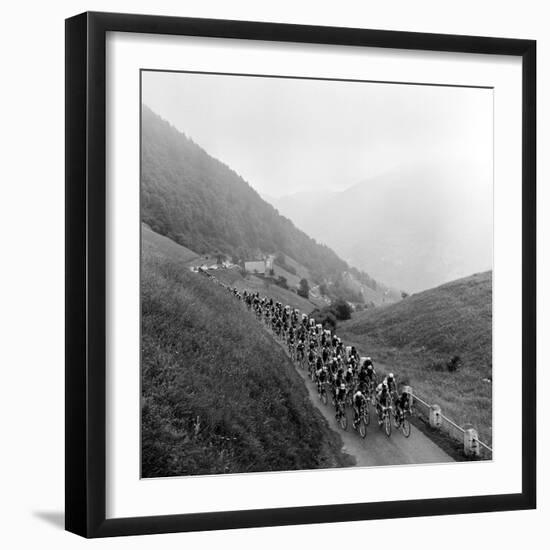 Contestants in the Grueling Tour De France are Seen on Their Way to the Mente Pass--Framed Photographic Print