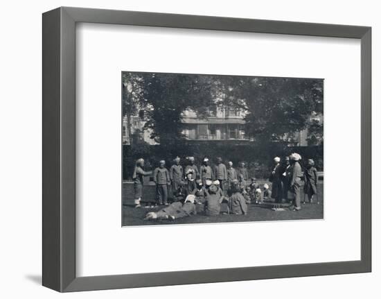 'Convalescent Indian Soldiers Playing Quoits on the Eastern Lawns', c1915, (1939)-Unknown-Framed Photographic Print