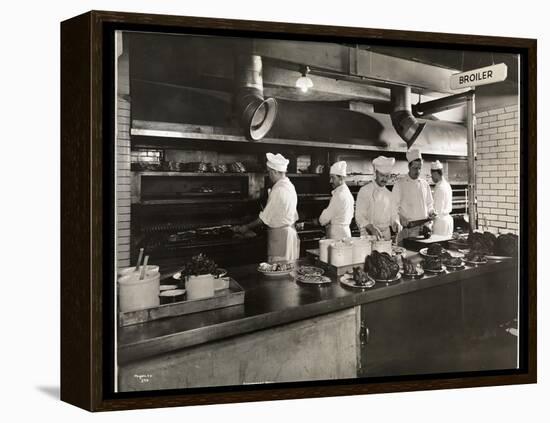 Cooks at the Broiler in the Kitchen of the Hotel Commodore, 1919-Byron Company-Framed Premier Image Canvas