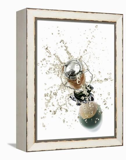 Cork Flying Out of a Sparkling Wine Bottle-Kröger & Gross-Framed Premier Image Canvas