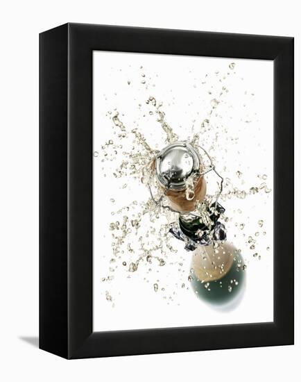 Cork Flying Out of a Sparkling Wine Bottle-Kröger & Gross-Framed Premier Image Canvas