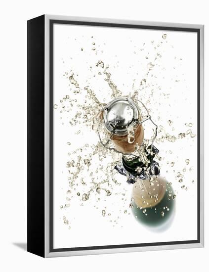 Cork Flying Out of a Sparkling Wine Bottle-Kröger & Gross-Framed Premier Image Canvas