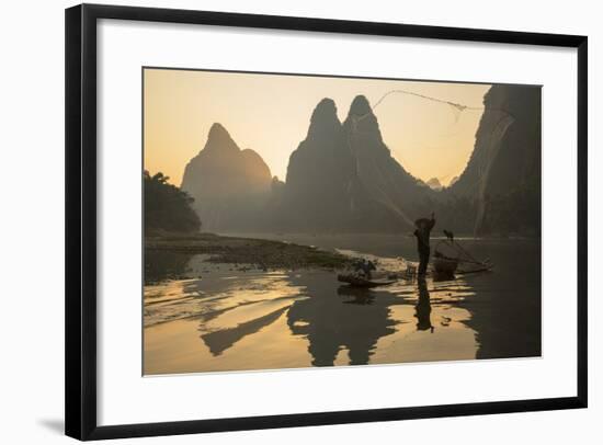 Cormorant Fisherman Throwing Net on Li River at Dawn, Xingping, Yangshuo, Guangxi, China-Ian Trower-Framed Photographic Print