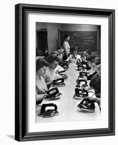 Cornell's Home Economics students learn different elements of irons and proper maintenance of it-Nina Leen-Framed Photographic Print