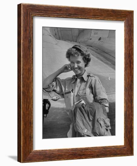 Correspondent Marguerite Higgins Smiling, Leaning Against Airplane-Carl Mydans-Framed Photographic Print