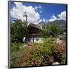Cottage Garden at Polznkaspar House with Parish Church of St. Martin-null-Mounted Art Print