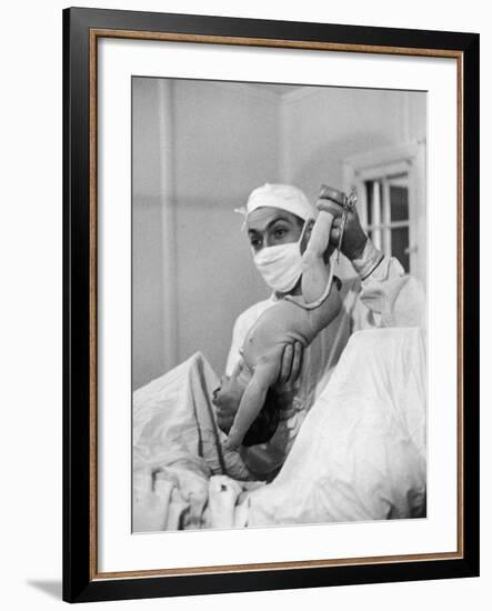 Country Doctor Ernest Ceriani Delivering a Baby-W^ Eugene Smith-Framed Photographic Print