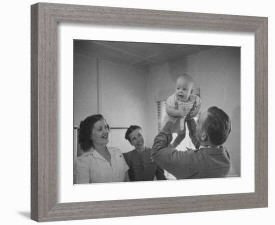 Country Doctor Ernest Ceriani Giving Checkup to 8 Month Old Infant Mike Huffaker-W^ Eugene Smith-Framed Photographic Print