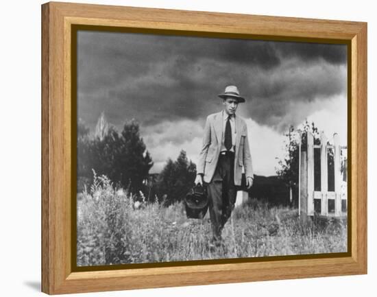 Country Doctor Ernest Ceriani Making House Call on Foot in Small Town-W^ Eugene Smith-Framed Premier Image Canvas