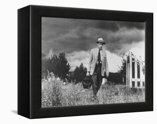 Country Doctor Ernest Ceriani Making House Call on Foot in Small Town-W^ Eugene Smith-Framed Premier Image Canvas