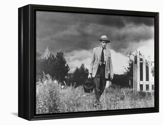 Country Doctor Ernest Ceriani Making House Call on Foot in Small Town-W^ Eugene Smith-Framed Premier Image Canvas