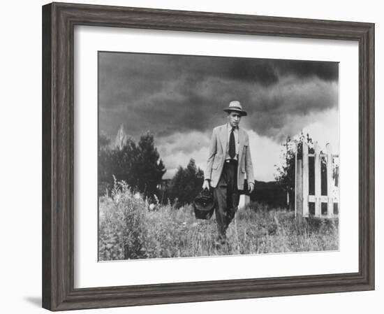 Country Doctor Ernest Ceriani Making House Call on Foot in Small Town-W^ Eugene Smith-Framed Photographic Print