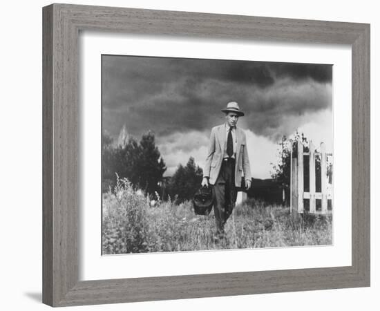 Country Doctor Ernest Ceriani Making House Call on Foot in Small Town-W^ Eugene Smith-Framed Photographic Print