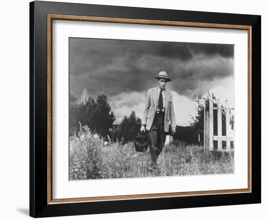 Country Doctor Ernest Ceriani Making House Call on Foot in Small Town-W^ Eugene Smith-Framed Photographic Print