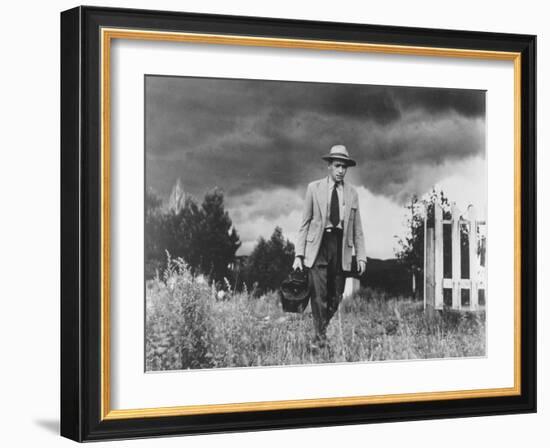 Country Doctor Ernest Ceriani Making House Call on Foot in Small Town-W^ Eugene Smith-Framed Photographic Print